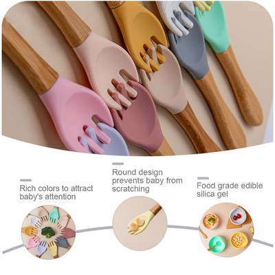 La forcella di legno della maniglia dei bambini infantili liberi di Bpa ha messo il cucchiaio del bambino del silicone